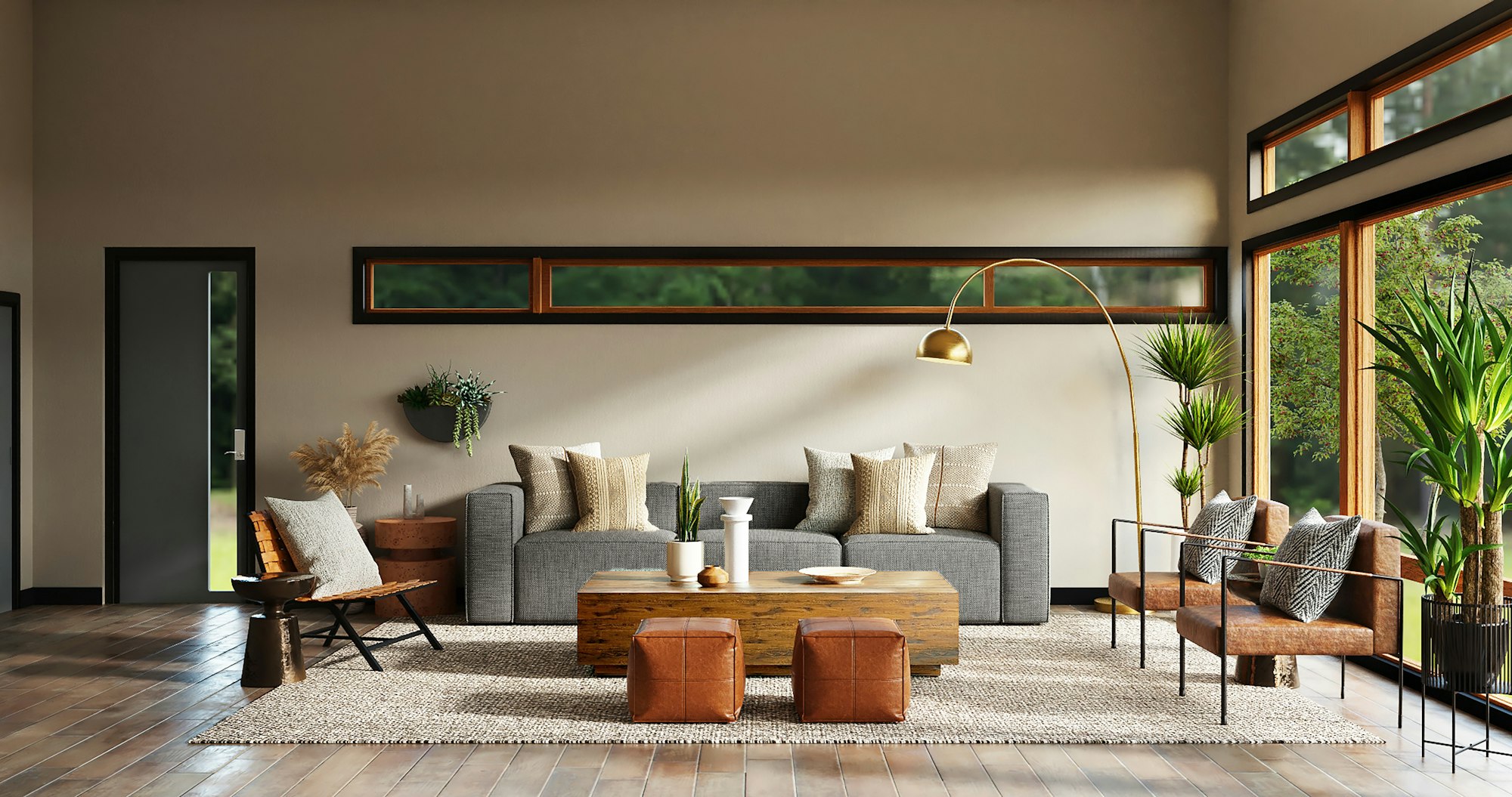 A warm modern living room with a gray sofa, leather ottomans, a long clerestory window and tall glass doors to the garden